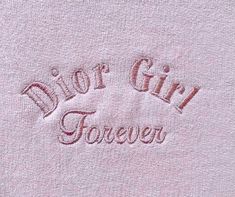 a pink towel with the word, doctor girl forever written in red ink on it