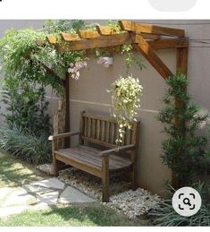 a wooden bench sitting under a pergolated trellis