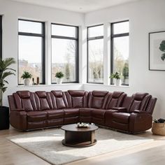 a living room filled with furniture and large windows