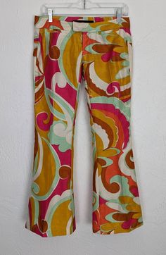 "✰ Rare Miss Sixty Pucci Style  ✰ Polyester material gives good structure. No stretch ✰ Sassy bell cropped capris would look great with some platforms ✰ 2 front coin pockets and 2 back faux pockets Circa: 2000s Material: 100% polyester Label: Miss Sixty, made in Italy - MEASUREMENTS- (measurements taken flat) please refer to listing images for how we measure Label size: 25 Waist: 15\" (please note that these are low-rise and sit closer to the hip bones and not the true waist) Hip: 18.5 Length: 3 Fitted Wide Leg Capris For Spring, Multicolor Flare Cotton Bottoms, Multicolor Cotton Flare Bottoms, Groovy Wide Leg Spring Bottoms, Groovy Wide Leg Bottoms For Spring, Spring Groovy Wide Leg Bottoms, Spring Groovy Wide-leg Bottoms, Retro Stretch Flare Bottoms, Retro Flare Bottoms For Summer