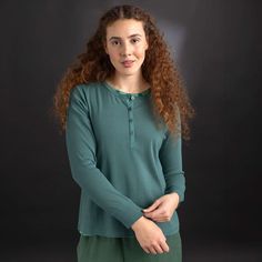 Henley shirt with snaps in front. Full-length sleeves with wide cuffs. Yoke over the shoulders and decorative flatlock seams. Ribbed cotton: 96% organic cotton/4% spandex. Machine wash warm, delicate cycle. Made in Noida, India. Gudrun Sjödén Henley Shirt In Organic Ribbed Cotton - Opal Green Green Collared Cotton T-shirt, Green Cotton T-shirt With Buttons, Green Soft-washed Cotton Tops, Green Relaxed Fit Cotton T-shirt, Grandfather Shirts, Hippie Mode, Soft-washed Green Cotton T-shirt, Henley Shirt, Scandinavian Fashion