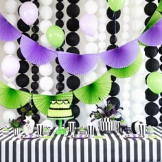 a birthday party with black, white and green decorations