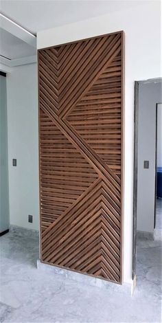 a large wooden door in the middle of a room