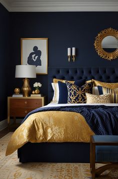 a bedroom with blue walls and gold bedding