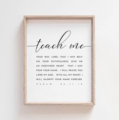 a framed print with the words teach me in cursive writing