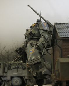 an army vehicle with a large tank on it's back