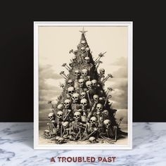 a group of skulls sitting on top of each other in front of a christmas tree