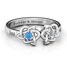 two heart shaped rings with the words faith hope love and an intertwined design on each ring