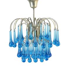 a chandelier with blue glass drops hanging from it