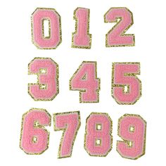 pink and gold numbers with glitter on them