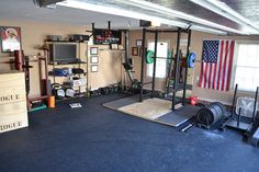 the garage is clean and ready to be used as a home gym or workout facility