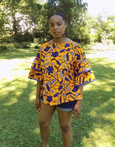 Wax Print Blouse Bold, beautiful blouse in top quality African wax fabric 100% Cotton Length: Approximately 25 inches SIZEBUSTWAIST   14          42           36   16          44           38   18          46           40   20          48           42 Wear with shorts, a pencil skirt or jeans.  Perfect Summer/Fall Blouse Full flared sleeves for a comfortable but flattering fit Care Instructions: Wash with like colors. Warm iron as needed Casual Yellow Tunic Blouse, Casual Multicolor Bell Sleeve Tops, Multicolor Bell Sleeve Casual Tops, Cotton Floral Print Half Sleeve Tops, Fitted Floral Print Blouse With Half Sleeves, Fitted Half Sleeve Floral Print Blouse, Fitted Half Sleeve Floral Blouse, Fitted Yellow Printed Blouse, Yellow Half Sleeve Summer Blouse