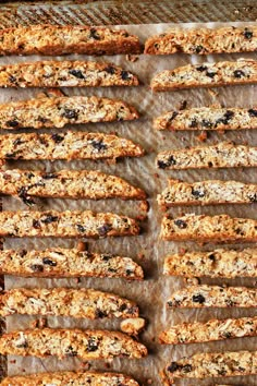 homemade granola bars are lined up on a baking sheet and ready to be baked