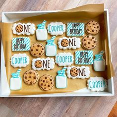 a cookie box filled with cookies and decorated cookies