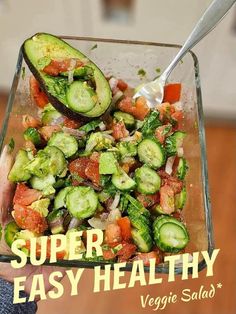 a person holding a glass dish with vegetables in it and the title super easy healthy veggie salad