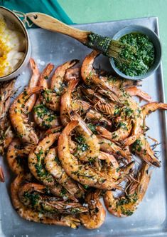 grilled shrimp with parsley and garlic on a platter