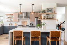 three chairs are sitting at the kitchen island