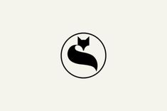 a black and white logo with an image of a cat in a circle on it