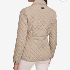 Chic Calvin Klein Short Quilted Jacket Diamond Quilted Jacket Has A Spread Collar, Long Sleeves, And A Front Button Closure 100% Poly Machine Wash Beige Quilted Jacket For Work, Calvin Klein Beige Outerwear For Work, Fitted Beige Calvin Klein Outerwear, Calvin Klein Beige Long Sleeve Outerwear, Calvin Klein Beige Outerwear For Spring, Calvin Klein Casual Beige Outerwear, Casual Beige Calvin Klein Outerwear, Calvin Klein Beige Spring Outerwear, Womens Quilted Jacket