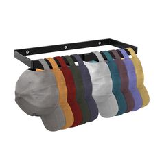 six pairs of baseball caps hanging on a rack with black metal brackets and four different colors