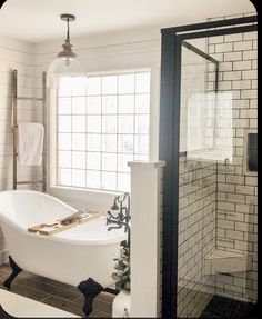 a white bath tub sitting next to a window