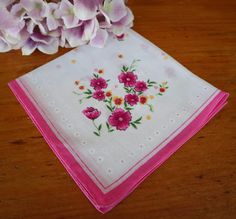 "For your consideration is a beautiful vintage handkerchief with a lovely pink and white floral design. It is in good condition with no holes, no pulls, no stains.  It measures 11\"  x 11\"  and is made out of a soft cotton. If you have any questions, please convo me. Check out some other handkerchiefs listed at Treasure Cove Ally http://www.etsy.com/shop/treasurecoveally/search?search_query=hankies&search_type=user_shop_ttt_id_6215422&shopname=treasurecoveally I typically ship within 3-5 days of purchase, however, if you need your item shipped asap, please contact me and I will do my best to accommodate. Shipping: Item is being shipped from Canada. Shipping price quoted is for Surface which is the cheapest rate and take 10 to 15 business days. Should you require faster service such as air Vintage Pink Handkerchiefs For Wedding, Vintage Pink Wedding Handkerchiefs, Vintage White Floral Print Handkerchiefs, Retro Pink Handkerchiefs As Gift, Vintage Pink Handkerchief With Floral Print, Vintage Pink Flower-shaped Handkerchief, Pink Vintage Flower-shaped Handkerchief, Pink Flower Shaped Handkerchiefs For Gifts, Flower Shaped Pink Handkerchiefs For Gifts