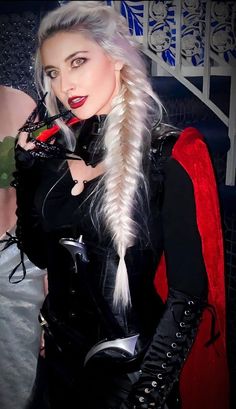 a woman with long white hair wearing a costume