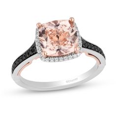 a pink diamond ring with black and white diamonds