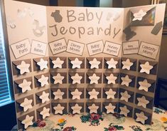 a baby shower board with paper cutouts on it