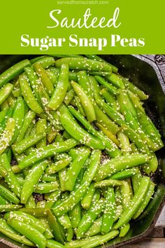 sauteed sugar snap peas in a cast iron skillet with sesame seeds on top