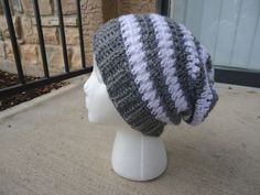 a knitted hat sitting on top of a mannequin head