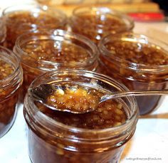 several jars filled with food sitting on top of a table