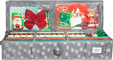 an open suitcase filled with christmas items and wrapping paper on top of it's sides