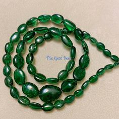 Thank you for coming in! T-savorite(green garnet) freeform nugget beads with great size and deep forest green color and spectacular gem clarity for this stone! This is very rare size and cut for this stone! 18" strand, 123 carats! You'll get the strand you see!  SIZE: 4.5mmx6.3mm to 10.65mmx14.5mm GRADE: Transparent with minor feathers COLOR: Deep Forest Green Deep Forest Green, Forest Green Color, Green Garnet, Colorful Feathers, Deep Forest, Very Rare, Forest Green, Green Color, Garnet