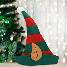 Description: Introducing our vibrant and attention-grabbing elf hat This hat is designed to make you the star of any party with its bright and saturated colors. The striped pattern, along with plush decoration on the top, adds a touch of fun and playfulness. What sets this hat apart is the unique ear patterns, making it truly distinctive. Crafted with fine workmanship, this hat is built to last and will not easily deform. It is perfect for various occasions such as Halloween, Christmas, performa Outfit Description, Witch Hat Halloween, Halloween Supplies, Elf Hat, Halloween Party Supplies, Masquerade Party, Saturated Color, Witch Hat, The Elf