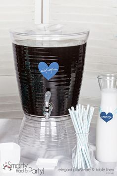 a blender sitting on top of a table with paper straws