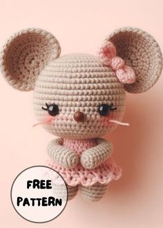 a small crocheted mouse is posed on a pink background with the caption free pattern