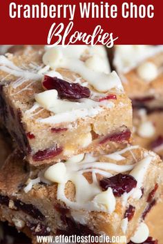 three pieces of dessert sitting on top of a wooden cutting board with white icing