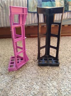 two plastic chairs sitting next to each other on the floor in front of a bed