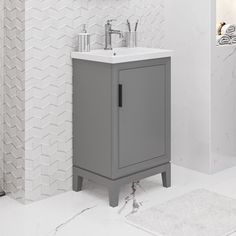 a bathroom with a sink, mirror and towel rack on the wall next to it