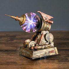 an antique looking clock with a purple light coming out of it's centerpiece