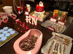 a table topped with lots of desserts and candies