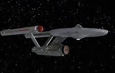 a star trek ship flying through the night sky