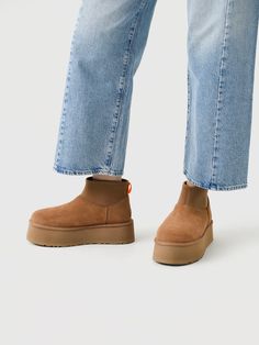 DESCRIPTION:A fashionable boot made from soft suede and finished with a soft UGGplush™ interior and a platform sole.FEATURES:Round ToeBack Pull TabSuede Upper17mm UGGplush™ Lining & InsoleFoam FootbedEVA Midsole & OutsolePlatform Height: 2 in. Ugg Mini Platform, Ugg Platform, Polo Shoes, Snowboard Shop, Ugg Mini, Ugg Classic Mini, Denim Sweater, Ugg Classic, Saint Bernard