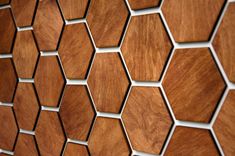 a close up view of some wood hexagonal tiles