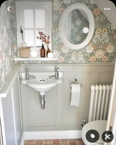 a bathroom with a sink, mirror and toilet in it's corner next to a radiator