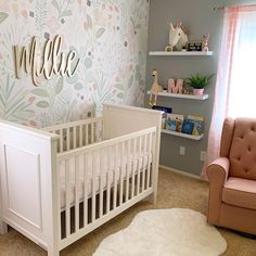 a baby's room with a pink chair and white crib