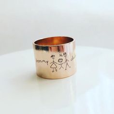 Custom handwriting tube ring, engraved rose gold ring band, child drawing ring, Signature ring, memorial  keepsake gift, personalized ring.Material: gold, silver and rose plated over brass., eco-friendly brass, all the brass and plating are lead nickel chromium free.Dimensions: 19.5mm out diameter, 18mm inside diameter, 15mm tall, brass thick: 0.8mm.******SIZE 8❤ Item will arrive in an beautiful gift box, perfect for gift giving.Back to my shop:https://www.etsy.com/shop/MyWhysCare Instructions:A Child Drawing, Gold Ring Band, Rose Gold Band Ring, Signature Ring, Signature Rings, Handwriting Jewelry, Ring Rosegold, Personalized Ring, Ringe Gold