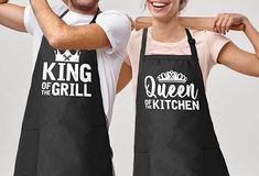 two people wearing aprons with the words king and queen of the grill on them