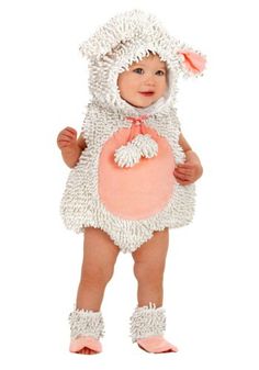 a baby dressed in a sheep costume